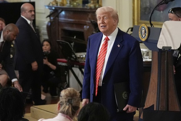 President Donald Trump addresses the audience at an event for Military Mothers, in the East Room of the White House, Thursday, May 8, 2025, in Washington. (AP Photo/Alex Brandon)
Donald Trump,Melania  ...