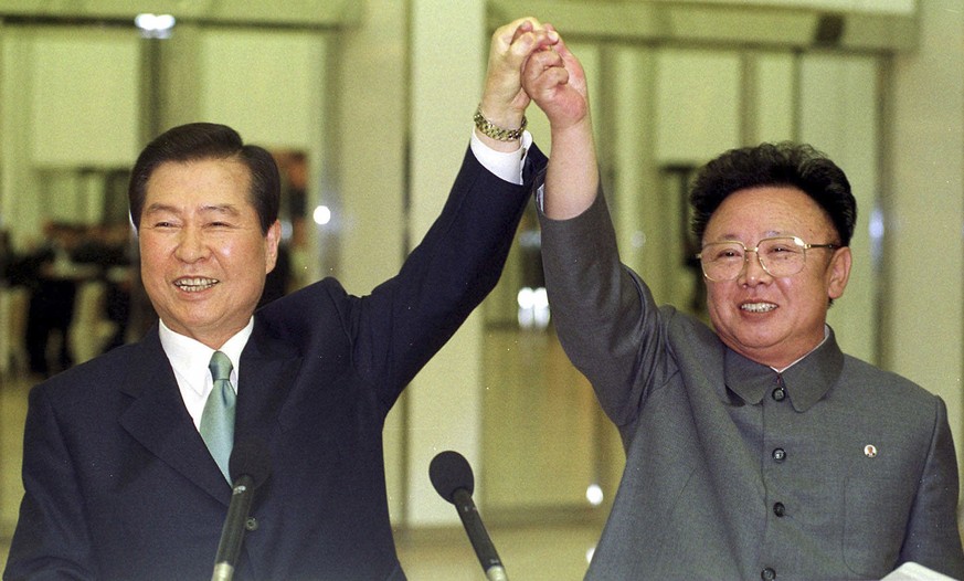 FILE -- In this June 14, 2000, file photo, then South Korean President Kim Dae-jung, left, and then North Korean leader Kim Jong Il raise their arms together before signing a joint declaration during  ...