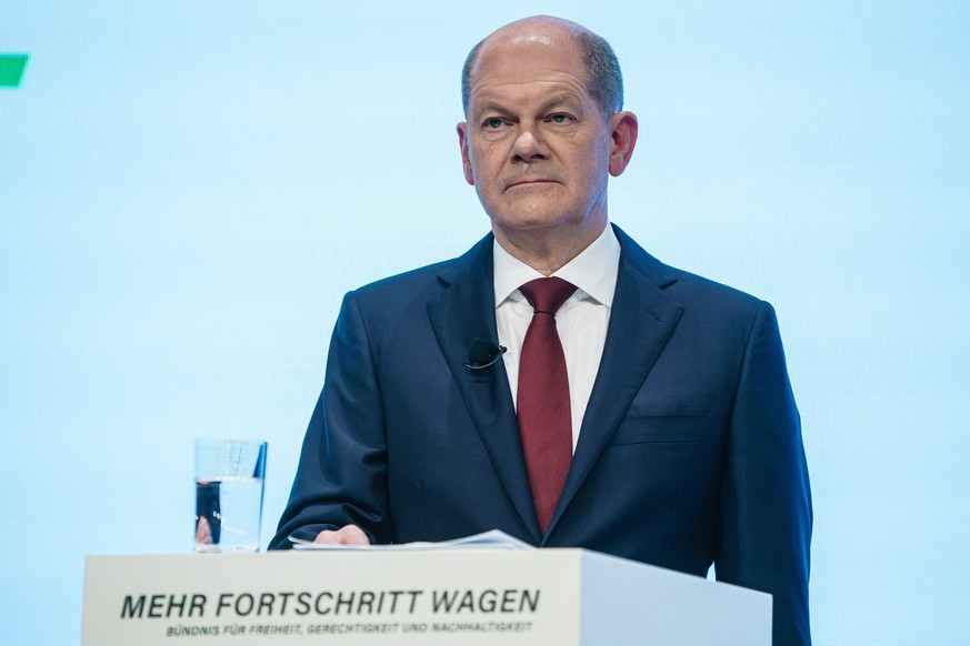 epa09600964 Acting German Minister of Finance and Social Democratic Party (SPD) top candidate for the federal elections Olaf Scholz looks on during the presentation of the coalition contract in Berlin ...