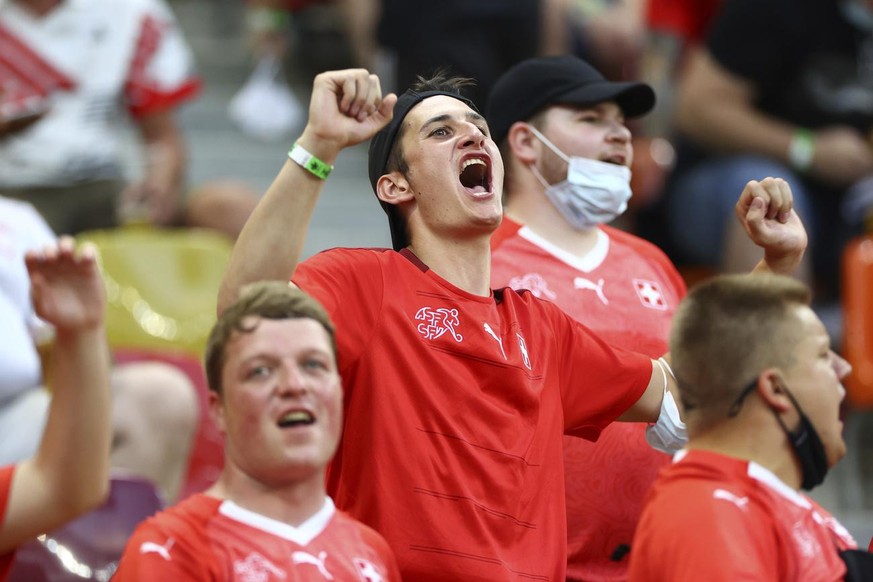 Switzerland&#039;s fans cheer prior to the Euro 2020 soccer championship round of 16 match between France and Switzerland at the National Arena stadium, in Bucharest, Romania, Monday, June 28, 2021. ( ...