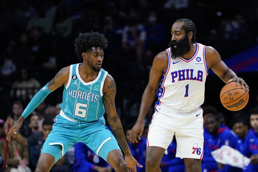 Philadelphia 76ers&#039; James Harden, right, tries to get past Charlotte Hornets&#039; Jalen McDaniels during the first half of a preseason NBA basketball game, Wednesday, Oct. 12, 2022, in Philadelp ...