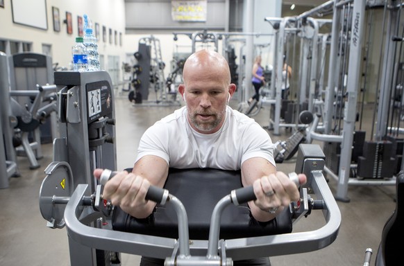 Noah Nichols works out at the Rock Fitness Center on Friday, April 24, 2020 in Ringgold, Ga. Gyms, along with hair salons, bowling alleys and tattoo parlors were among the businesses allowed to open o ...