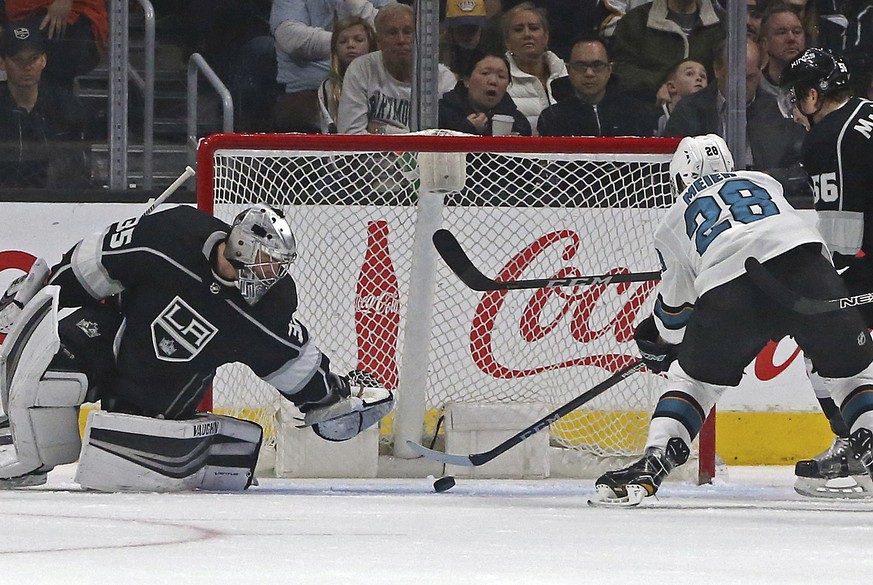 Los Angeles Kings goalie Darcy Kuemper (35) stops a shot by San Jose Sharks right winger Timo Meier (28) in the second period of an NHL hockey game in Los Angeles Monday, Jan. 15, 2018. (AP Photo/Reed ...