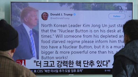 People watch a TV news program showing the Twitter post of U.S. President Donald Trump while reporting North Korea&#039;s nuclear issue, at Seoul Railway Station in Seoul, South Korea, Wednesday, Jan. ...