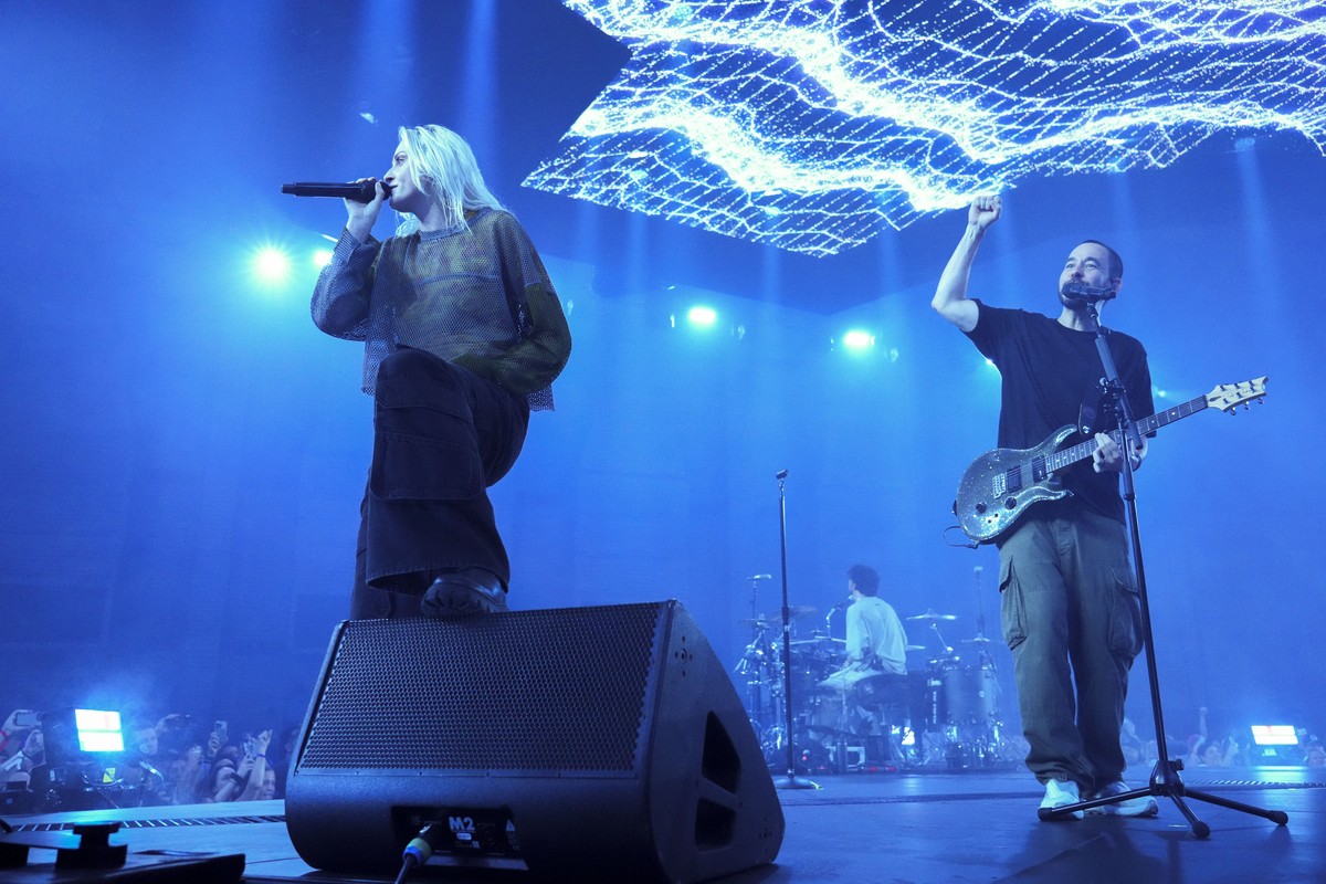 Emily Armstrong, from left, Colin Brittain, and Mike Shinoda of Linkin Park perform Thursday, Sept. 5, 2024, in Los Angeles. It was announced on Thursday that Dead Sara's Emily Armstrong would jo ...
