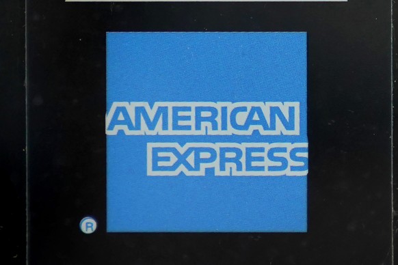 FILE - An American Express logo is attached to a door in Boston&#039;s Seaport District, July 21, 2021. American Express announced Friday, June 21, 2024, it will acquire the dining reservation and eve ...