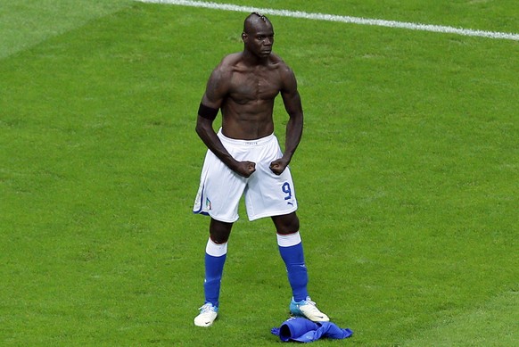 Italy's Mario Balotelli celebrates scoring his side's second goal during the Euro 2012 soccer championship semifinal match between Germany and Italy in Warsaw, Poland, Thursday, June 28, 201 ...