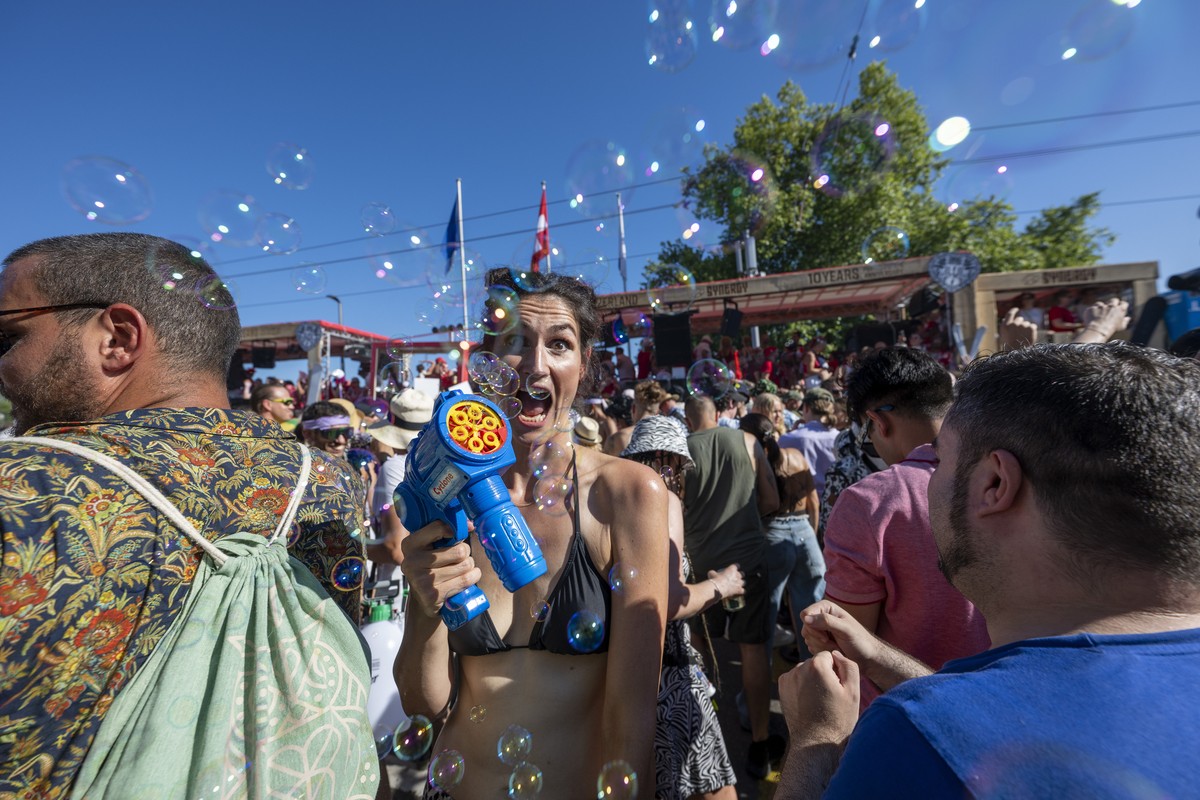 epa11543330 Participants attend the 31st Street Parade in the city center of Zurich, Switzerland, 10 August 2024. The annual dance music event Street Parade runs this year under the motto 'Prefer ...