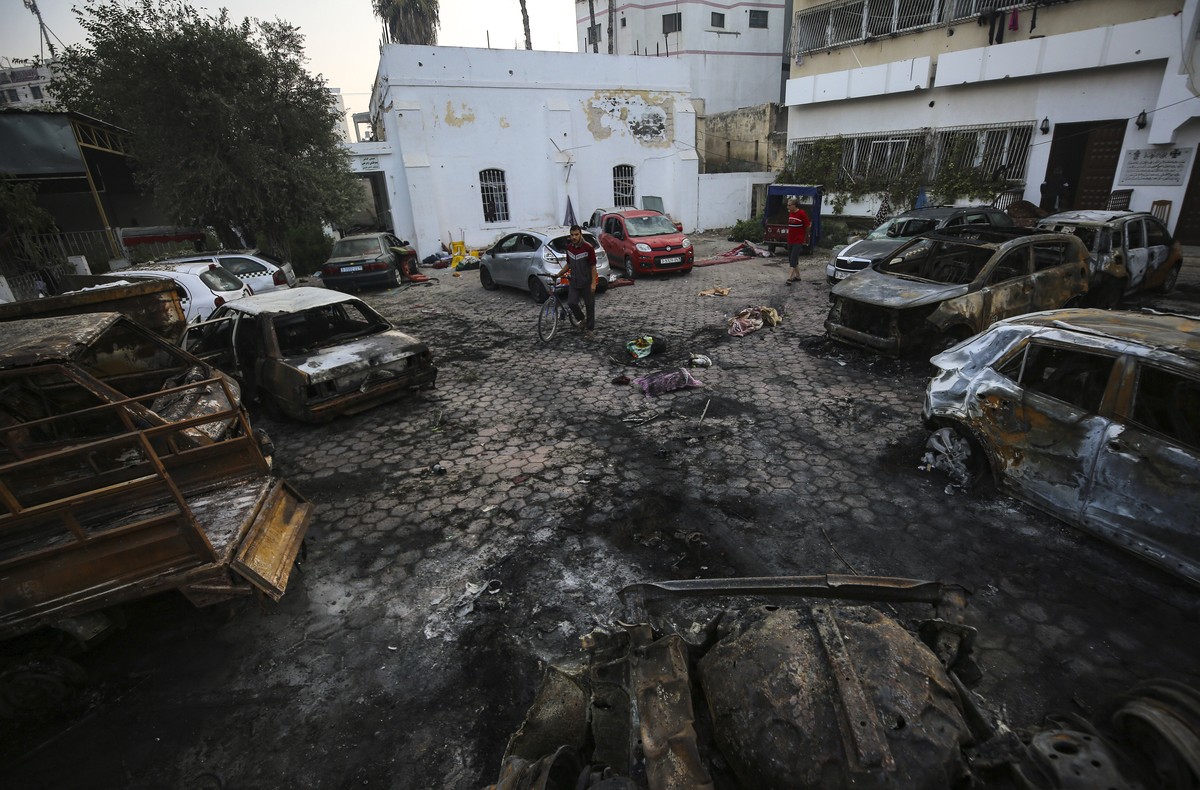 Palestinians look at the site of the explosion at al-Ahli hospital in Gaza City, Wednesday, Oct. 18, 2023. (AP Photo/Abed Khaled)