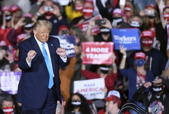 President Donald Trump dances during a campaign rally at Harrisburg International Airport, Saturday, Sept. 26, 2020, in Middletown, Pa. (AP Photo/Steve Ruark)