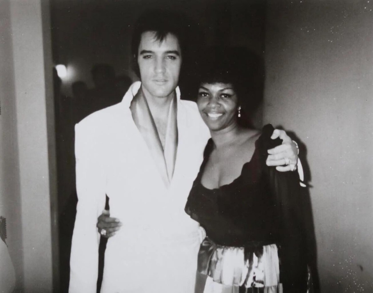 Elvis with Cissy Houston (Whitney's mother!) of the Sweet Inspirations, who sang backing vocals on his live shows.
