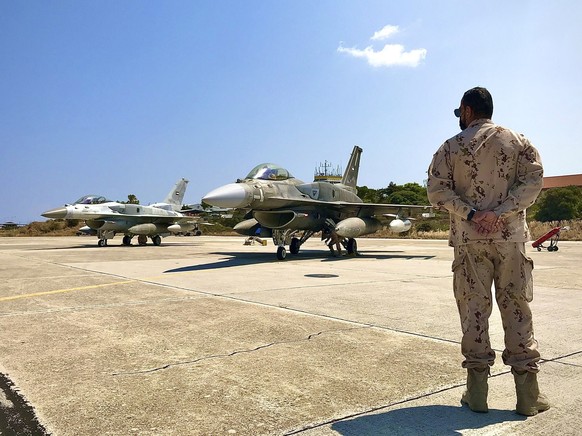 In this photo provided by the Greek Defense Ministry, air force jets from the United Arab Emirates arrive at the airbase of Souda to take part in a joint training with Greek forces, on the southern is ...