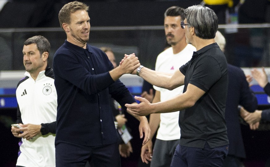 epa11433241 Germany&#039;s head coach Julian Nagelsmann (L) and Switzerland&#039;s head coach Murat Yakin (R) shake hands after a draw in the UEFA EURO 2024 Group soccer A match between Switzerland an ...