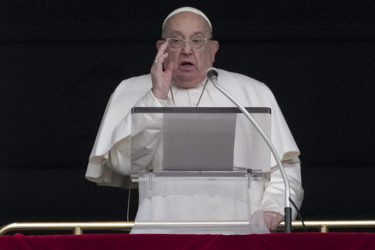 Pope Francis delivers his blessing as he recites the Angelus noon prayer from the window of his studio overlooking St.Peter's Square, at the Vatican, Sunday, Jan. 19, 2025. (AP Photo/Andrew Medic ...