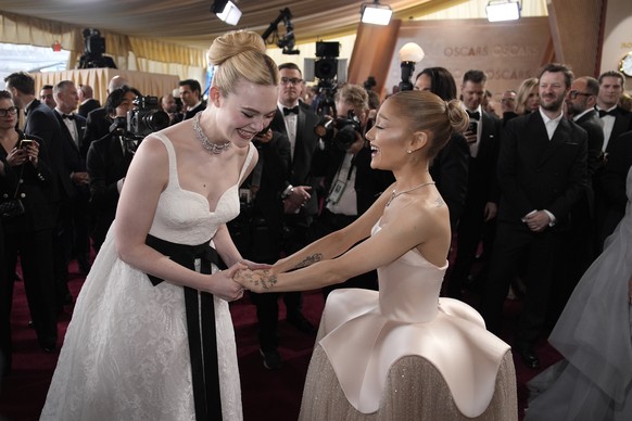 Elle Fanning, left, and Ariana Grande arrive at the Oscars on Sunday, March 2, 2025, at the Dolby Theatre in Los Angeles. (AP Photo/John Locher)
Elle Fanning,Ariana Grande