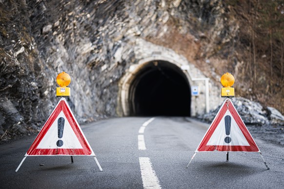 The closed of entrance of a road tunnel is pictured after over 100 cubic meters of fallen rocks collapsed Saturday evening, Monday, February 5, 2024 between the villages of Riddes and La Tsoumaz, in t ...