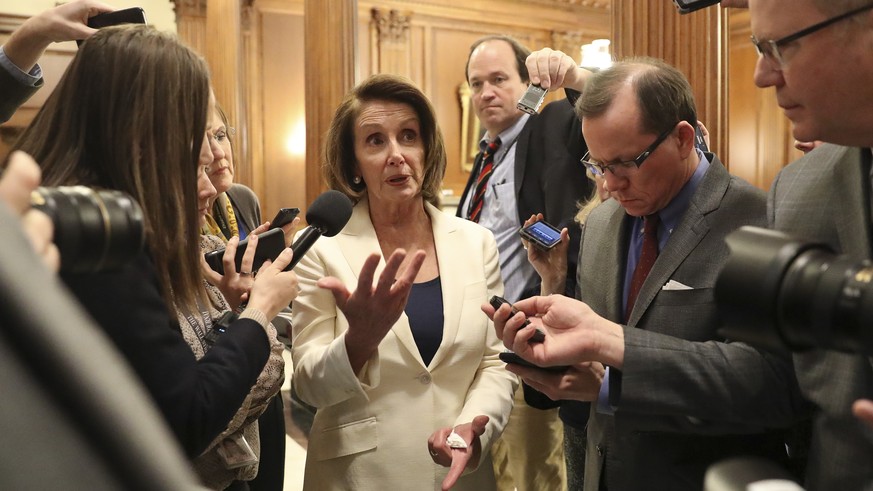 House Minority Leader Nancy Pelosi of Calif., speaks to reporters after she staged a record-breaking, eight-hour speech in hopes of pressuring Republicans to allow a vote on protecting &quot;Dreamer&q ...