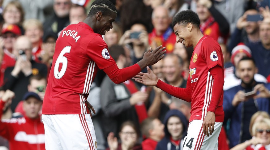 Britain Football Soccer - Manchester United v Leicester City - Premier League - Old Trafford - 24/9/16
Manchester United&#039;s Paul Pogba celebrates scoring their fourth goal with Jesse Lingard
Act ...