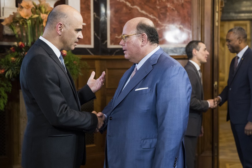 Swiss Federal President Alain Berset, left, welcomes US Ambassador Edward Thomas McMullen while Swiss Foreign Minister Ignazio Cassis, back left, welcomes Mamadou Henri Konate, Ambassador of Mail, dur ...