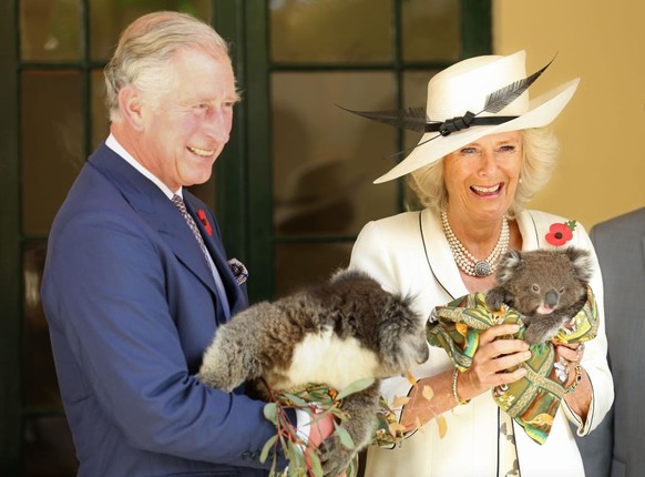 The Prince of Wales, and The Duchess of Cornwall hold Koalas at Government House in Adelaide, Australia. (Photo by Chris Radburn/PA Images via Getty Images)