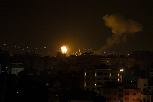 Fire and smoke rises following an Israeli airstrike in central Gaza Strip, Friday, Jan. 27, 2023. Gaza militants fired rockets at Israel and Israel carried out airstrikes as tensions soared following  ...