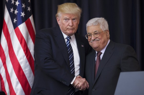 epa06369276 (FILE) - US President Donald J. Trump (L) shakes hands with Palestinian President Mahmoud Abbas (R) after they held a joint press conference at Abbas&#039; residence in Bethlehem, the West ...