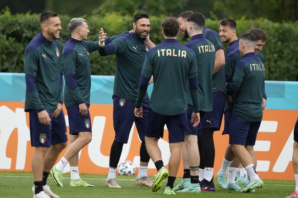 Italy players joke during a training session at Tottenham Hotspur training ground in London, Saturday, July 10, 2021 ahead of the Euro 2020 soccer championship final match against England at Wembley S ...