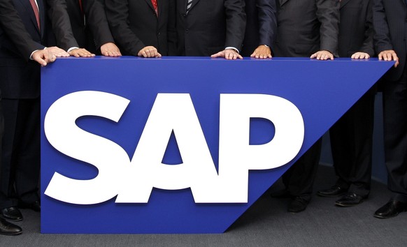 FILE - The board members of German software company SAP stand behind the company logo at its headquarters in Walldorf near Heidelberg, southwestern Germany, July 31, 2008. SAP has agreed to buy WalkMe ...