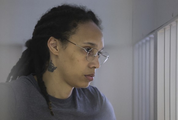 epa10105816 U.S. basketball player Brittney Griner stands inside a defendants&#039; cage during a court hearing in Khimki outside Moscow, Russia , 04 August 2022. The Khimki City Court reportedly had  ...