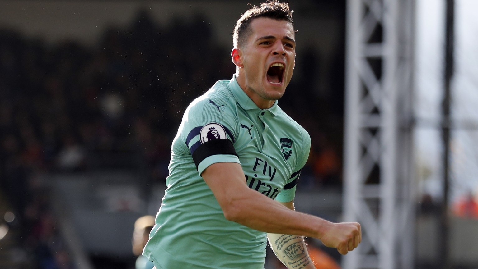 Arsenal&#039;s Granit Xhaka celebrates after scoring his side&#039;s first goal of the game during the English Premier League soccer match between Crystal Palace and Arsenal at Selhurst Park, London,  ...