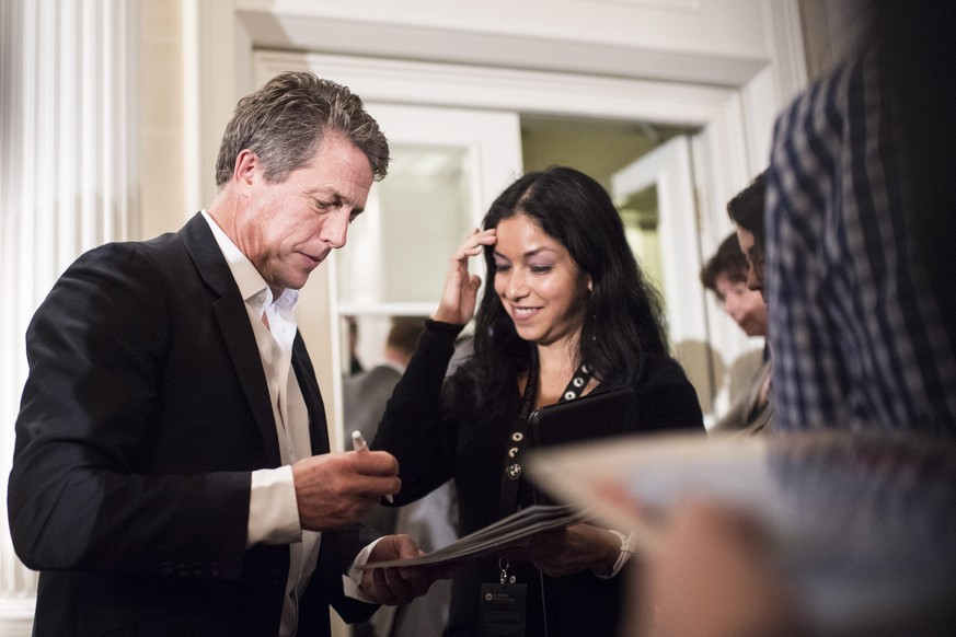 epa05558401 British actor Hugh Grant signs autographs after a press conference at the 12th annual Zurich Film Festival in Zurich, Switzerland, 27 September 2016. Grant received the Golden Icon award.  ...