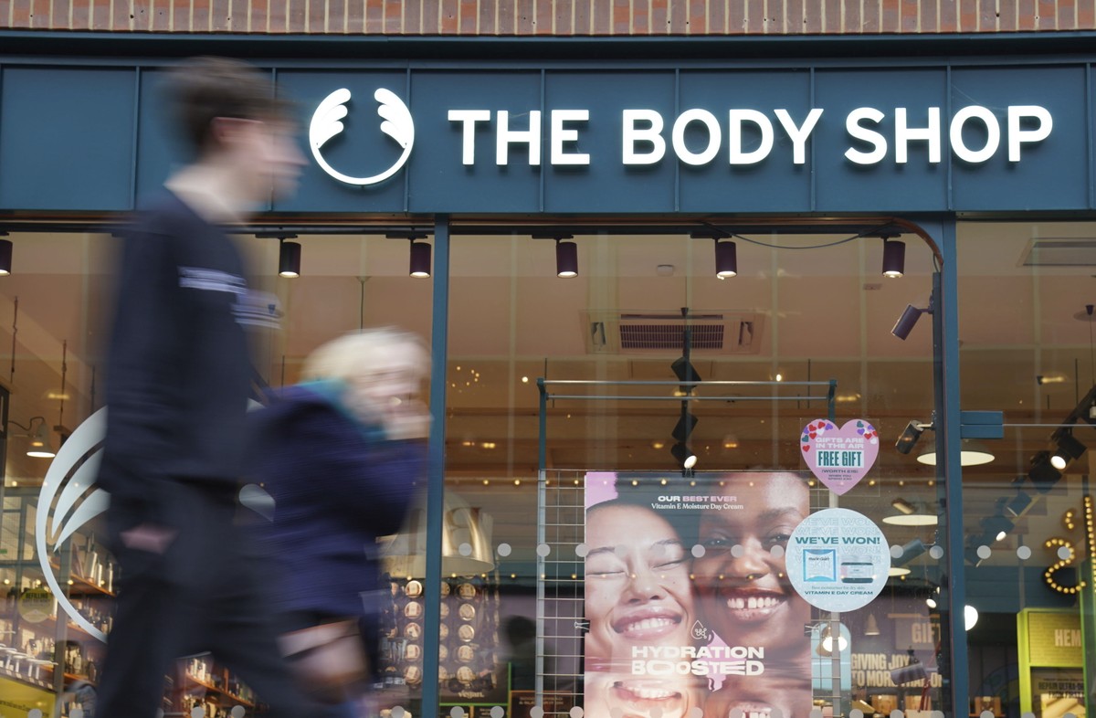 People walk past a Body Shop store in Canterbury, England, Tuesday, Feb. 13, 2024. The Body Shop, the British beauty and cosmetics retail chain, says it's appointed insolvency administrators afte ...