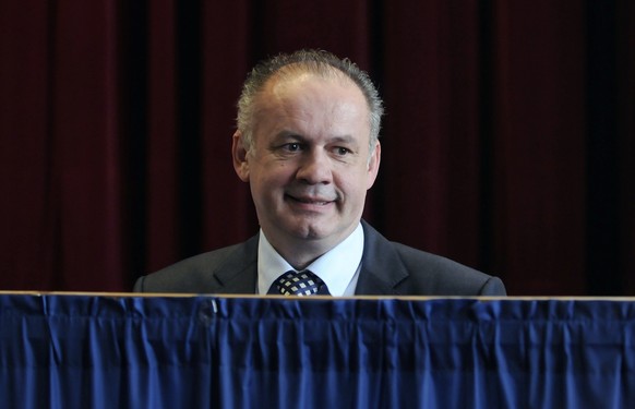 Presidential candidate, businessman and philanthropist Andrej Kiska prepares to cast his ballot in the second round of the presidential elections in Poprad, Slovakia, Saturday, March 29, 2014. Kiska´s ...