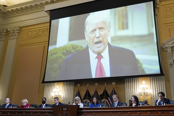 FILE - A video of President Donald Trump is shown on a screen, as the House select committee investigating the Jan. 6 attack on the U.S. Capitol holds a hearing at the Capitol in Washington, July 21,  ...