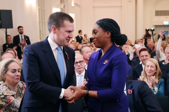 epaselect epa11697089 New Conservative Party leader Kemi Badenoch (R) is congratulated by candidate Robert Jenrick following the party?s new leader announcement in London, Britain, 02 November 2024. K ...