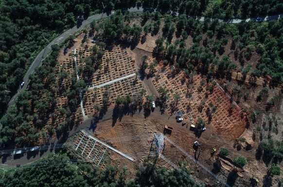 epa08837320 An aerial picture taken by drone shows newly buried graves of Covid-19 victims at the Baklaci cemetery in Istanbul, Turkey, 23 November 2020. Istanbul mayor Ekrem Imamoglu said that 184 pe ...