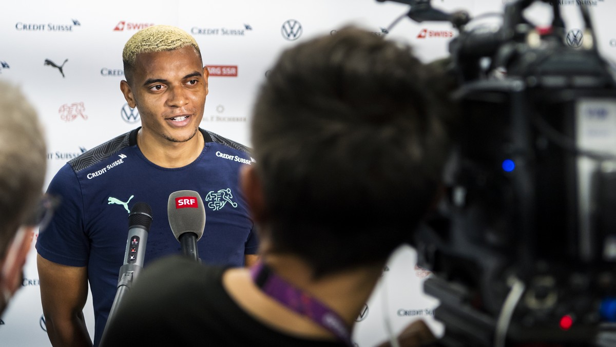 Switzerland's defender Manuel Akanji, speaks to journalists after a closed training session for the Euro 2020 soccer tournament, at the Steaua stadium, in Bucharest, Romania, Saturday, June 26, 2 ...
