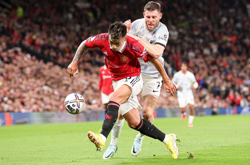 Mandatory Credit: Photo by Paul Currie/Shutterstock 13134297hm Lisandro Martinez of Manchester United, ManU and James Milner of Liverpool Manchester United v Liverpool, Premier League, Football, Old T ...