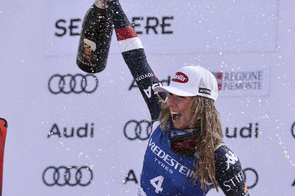 United States' Mikaela Shiffrin celebrates her 100th victory after an alpine ski, women's World Cup slalom, in Sestriere, Italy, Sunday, Feb. 23, 2025. (AP Photo/Marco Trovati)