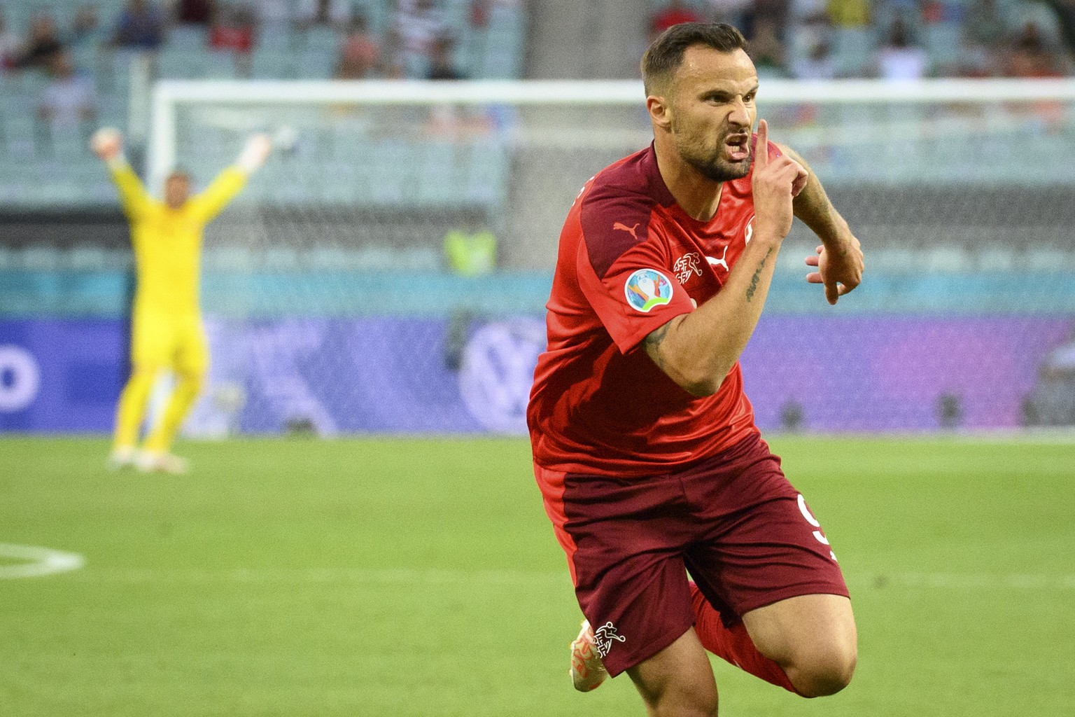 epa09288758 Haris Seferovic of Switzerland celebrates after scoring the opening goal during the UEFA EURO 2020 group A preliminary round soccer match between Switzerland and Turkey in Baku, Azerbaijan ...