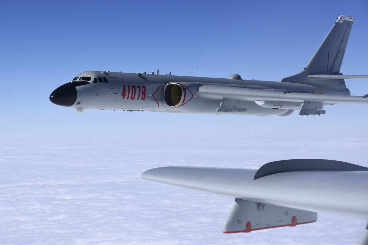 FILE - In this Nov. 23, 2017, file photo released by Xinhua News Agency, a Chinese military H-6K bomber is seen conducting training exercises, as the People's Liberation Army (PLA) air force cond ...