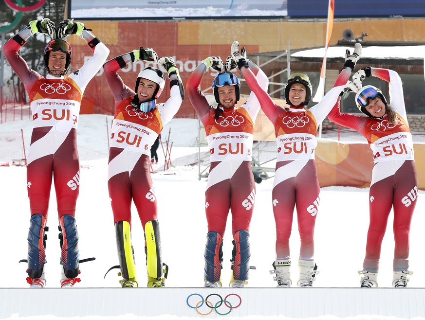 epa06559501 Gold medal winning team of Switzerland celebrates during the venue ceremony for the Alpine Team Event race at the Yongpyong Alpine Centre during the PyeongChang 2018 Olympic Games, South K ...