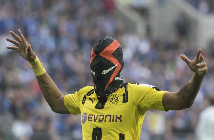 Pierre-Emerick Aubameyang from Dortmund celebrates with a mask after scoring during the German Bundesliga soccer match between FC Schalke 04 and Borussia Dortmund in the in Veltins Arena, Gelsenkirche ...