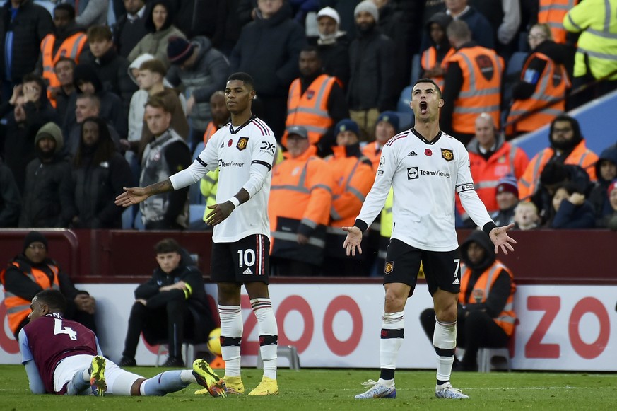 Manchester United&#039;s Marcus Rashford and Cristiano Ronaldo, right, react during the English Premier League soccer match between Aston Villa and Manchester United at Villa Park in Birmingham, Engla ...