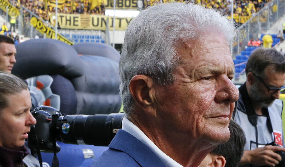 Hoffenheim's main sponsor and co-founder of the software company SAP, Dietmar Hopp, front, prior to the German Bundesliga soccer match between TSG 1899 Hoffenheim and Borussia Dortmund in Sinshei ...