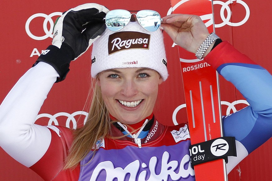 epa04042706 Lara Gut of Switzerland celebrates on the podium after winning the women's FIS Alpine Skiing World Cup SuperG race in Cortina d'Ampezzo, Italy, 26 January 2014. EPA/ANDREA SOLERO