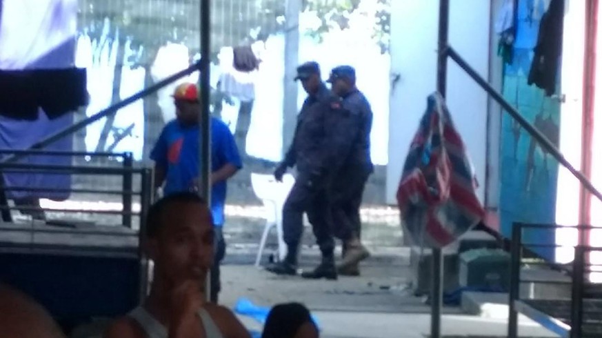 epa06344920 A handout photo made available by Abdul, a refugee on Manus Island, shows police reportedly entering the Manus Island detention centre on Manus Island, Papua New Guinea (PNG), 23 November  ...