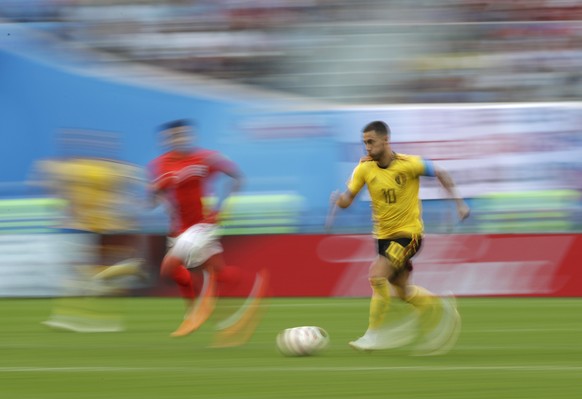 Belgium&#039;s Eden Hazard, right, is pursued by England&#039;s Jesse Lingard as he runs with the ball during the third place match between England and Belgium at the 2018 soccer World Cup in the St.  ...