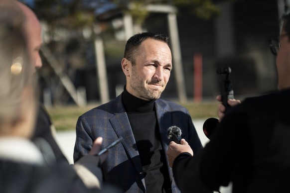 epa12620319 Mathias Reynard, State Councillor and president of the Council of State of the Canton of Valais, talks to the media on occasion of a press conference informing about a fire that broke out  ...