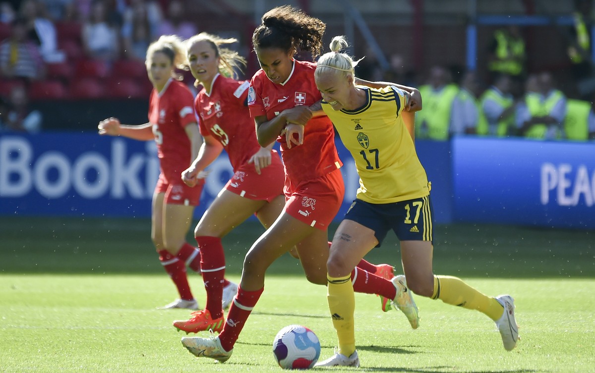 Switzerland's Coumba Sow, left, and Sweden's Caroline Seger fight for the ball during the Women Euro 2022 group C soccer match between Sweden and Switzerland at Bramall Lane stadium in Sheff ...